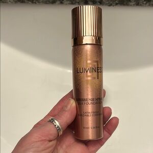 Luminess Brown Foundation with a sleek design and textured bottle